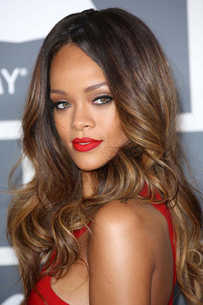 Rihanna Long layered hair with red lipstick